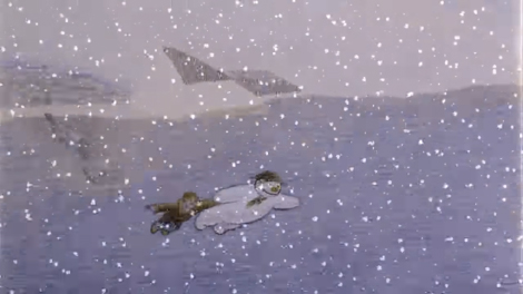 A shot from the animated short The Snowman. A book in pajamas looks out at the snow through his bedroom window.